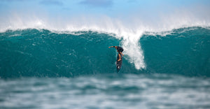 John Florence surfing in the impact suit