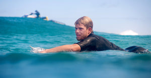 John Florence surfing in the impact suit