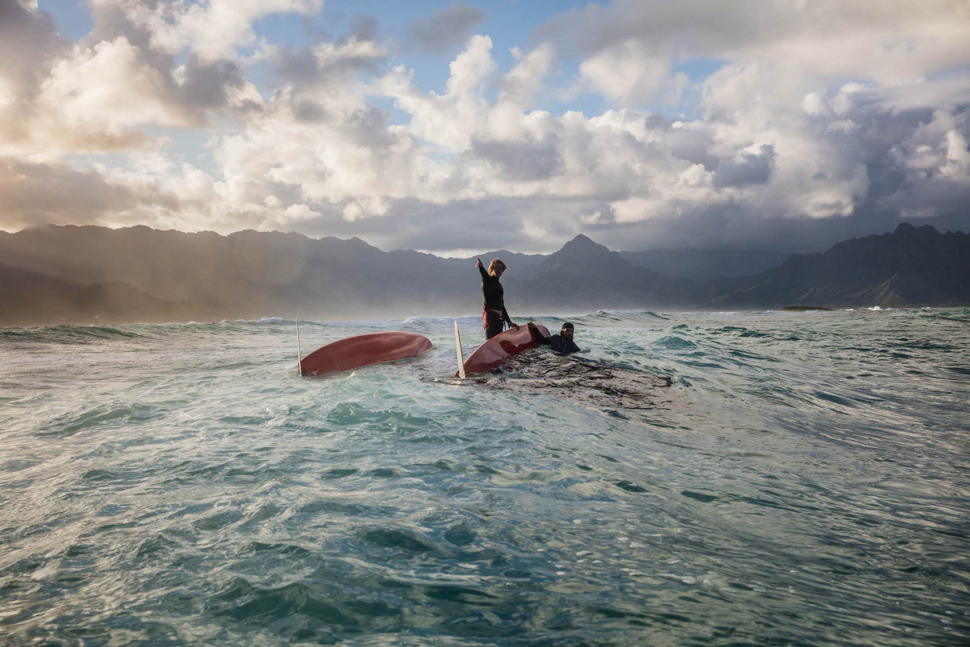 John Florence on a flipped over sailboat